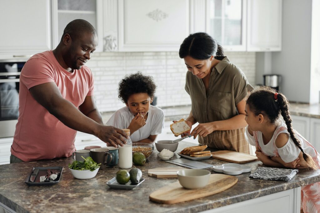 Residential home with family in kitchen Photo by August de Richelieu: https://www.pexels.com/photo/family-making-breakfast-in-the-kitchen-4259140/